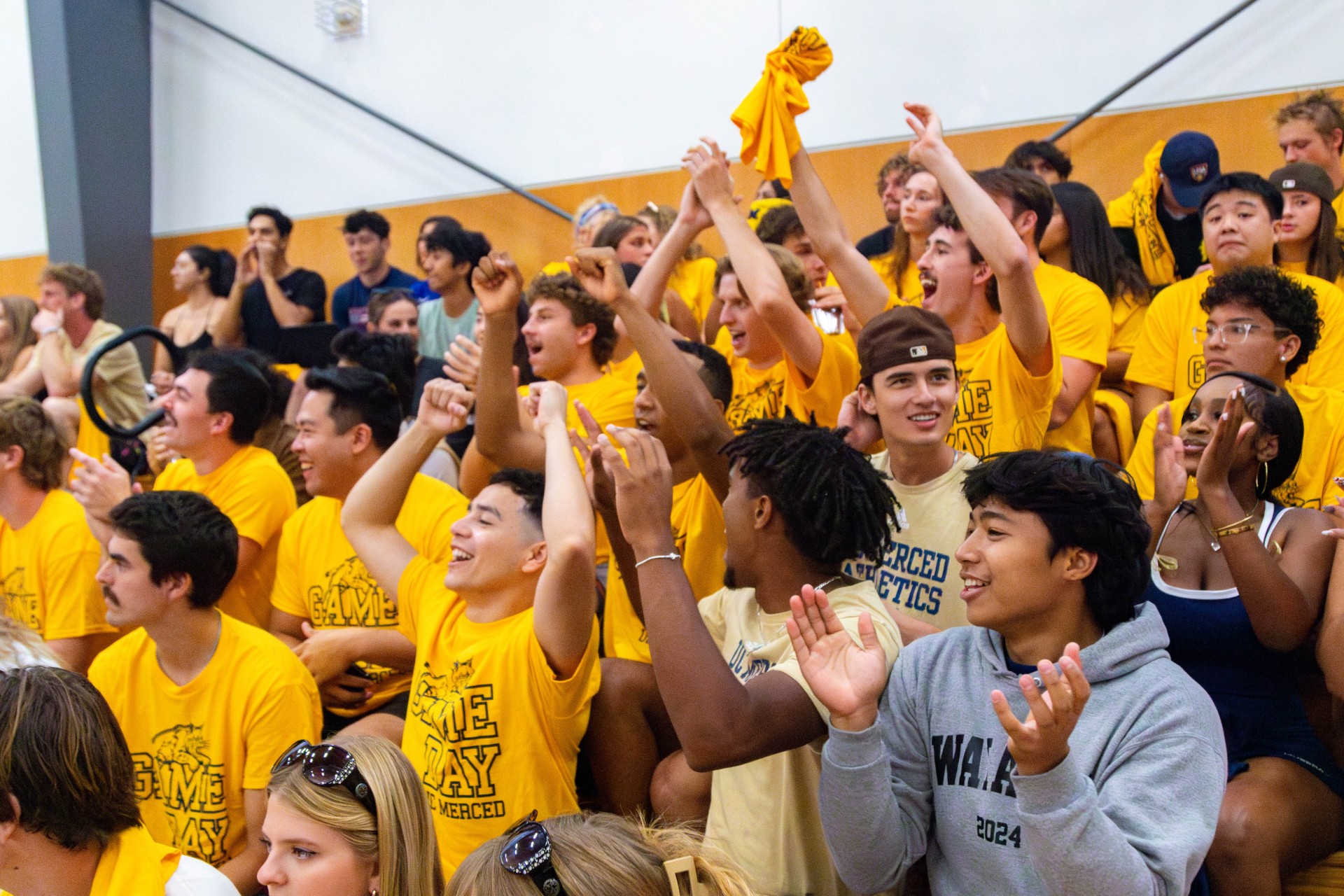 students cheering for uc merced bobcats athletics