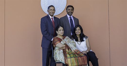 The Lakireddy family poses in front of UC Merced's Dr. Lakireddy Auditorium, one of the largest lecture halls on campus. Top: Dr. Hanimireddy Lakireddy and his son Dr. Vikram Lakireddy; Bottom: Hanimireddy's wife Vijaya and his daughter-in-law, Priya.