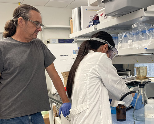 UC Merced professor and research student in lab