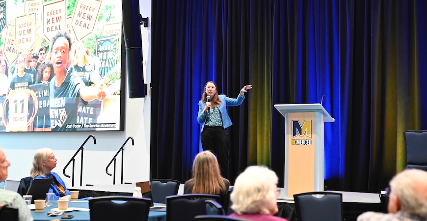 Leah Stokes, a political scientist, energy expert and climate communicator from UC Santa Barbara, speaks from the stage at UC Merced.