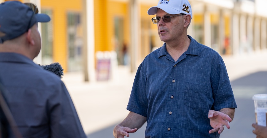 Jim Brugger, the retired director of campus engineering services, gestures while leading a tour of the UC Merced campus.