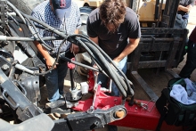 Sweet Steering team members work on the mechanism.