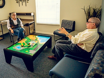 Professor Jeffrey Gilger (left) and Vice Chancellor Sam Traina discuss the future of the new center.