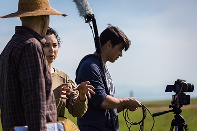 Sabah Ul-Hasan (center) works with Manny Collazo IV (right) on the first episode of BIOTA.