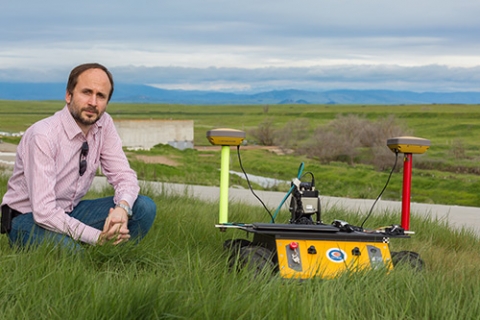 Professor Stefano Carpin and one of his robots