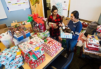 Student interns sort gifts for A Home for the Holidays, an outreach program that supports All Dads Matter. Student interns sort gifts for A Home for the Holidays, an outreach program that supports All Dads Matter.
