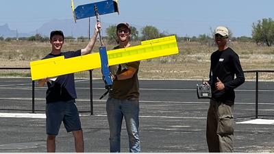UC Merced students hold a drone at a recent competition.